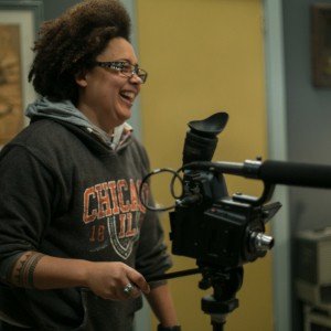 Shine Louis Houston on set laughing behind the camera 